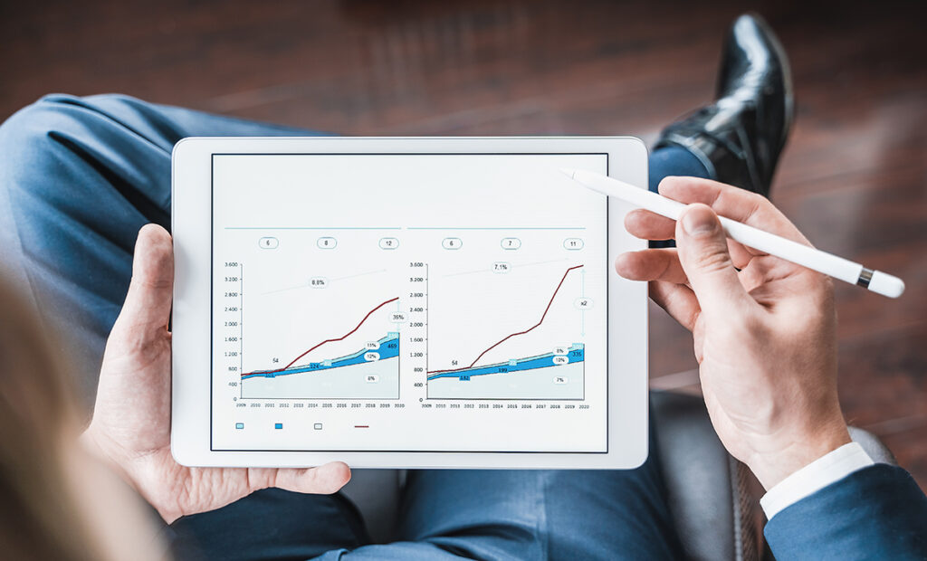 Working businessman,investor,trader.Financial report,presenatation in tablet.Diagram,gantt chart, analytics,project profit evaluation.Business meeting,negotiations.CEO,general manager.Bank investment.